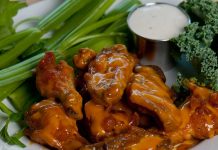 Key Lime Barbecue Chicken Wings Recipe Key Lime Barbecue Wings on a plate with celery and blue cheese sauce.