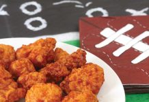 Boneless Buffalo Wings Boneless Buffalo Wings on a plate with Super Bowl decorations in the background