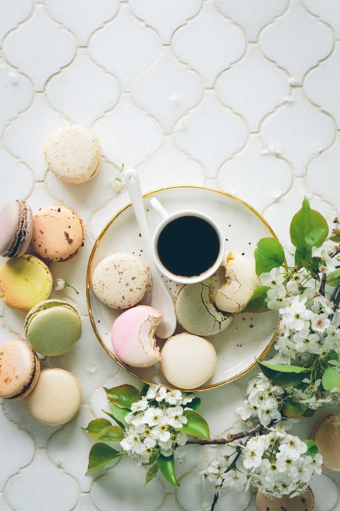 Macaroons served with a cup of coffee