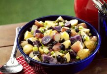 Red, White and Blue Potato Salad Red White and Blue Potato Salad in a bowl on a picnic table