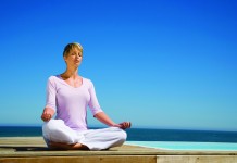 Meditation can reduce your stress (and pain) Woman meditating
