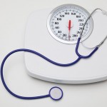 Eating fewer, larger meals may be healthier for obese women photo of a scale