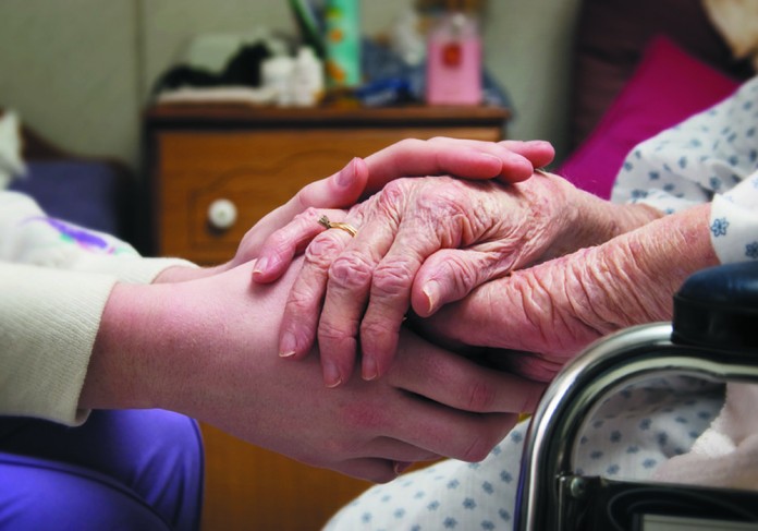 hospice photo holding hands