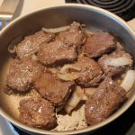 Venison steak in skillet