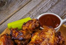 Raspberry Barbecue Wings Raspberry Barbecue Wings with extra sauce and celery on the side.