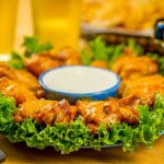 Super-safe food for Super Bowl Sunday Sweet Gingered wings on a plate.