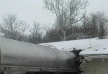 Milk hauling accident damages Belmont County home