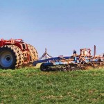 Gas compressor station could impact Pennsylvania farm Tractor working in field