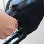 Increased oil and gas drilling leads to lower prices at the pump pumping gas