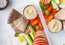 Hummus Hummus packed with fruits and vegetables for a school lunch.