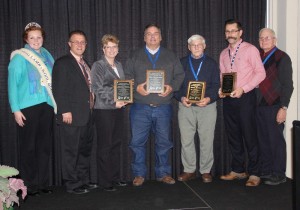 The Ohio Sheep Improvement Association, represented by Executive Director Roger High (left), presented its Distinguished Service Awards to (L-R) the Ohio Farm Bureau Federation communications department, represented by Pat Petzel; Don Van Nostran; Doran Gordon; and Dr. Paul Kuber.