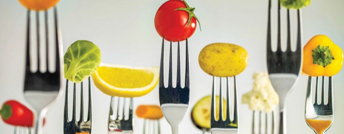 fruits and vegetables on forks