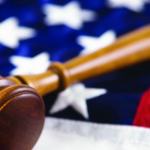 Thirteen states sue EPA, Army Corps of Engineers over definition of waterways flag and gavel