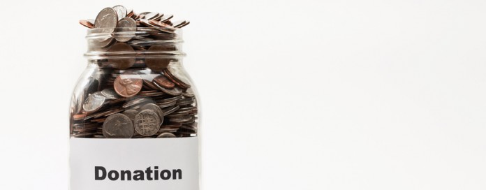 donation jar with coins donation jar with coins