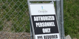 Although oil and gas production is up, Chesapeake posts 3Q loss chesapeake well site sign