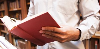 Holiday book gift ideas for the nature lover reading book in library