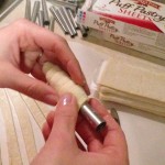wrapping puff pastry dough on clothespin cookie forms