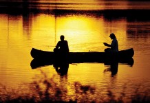 An angler for life, hooked from the start two men fishing in a canoe