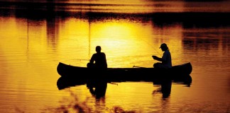 An angler for life, hooked from the start two men fishing in a canoe