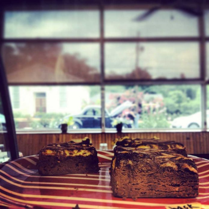 Cream Cheese Brownies Cream Cheese Brownies on a plate near a window with an antique truck outsite the window.