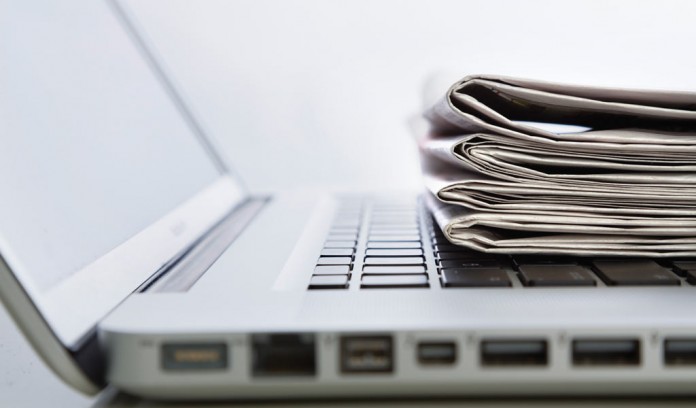 laptop and newspapers laptop and newspapers