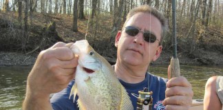 Anglers brave weather for crappies fisherman holding crappie
