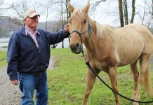 Gerards helped give equine trail riders miles of opportunity Petting a horse