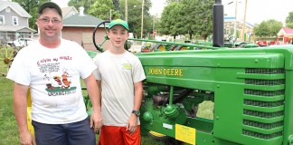 John Deere Expo features hundreds of tractors and stories Father and son with John Deere