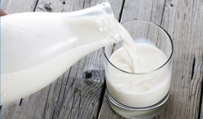 milk poured into glass milk poured into glass