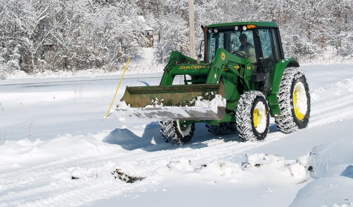 tractor plowing snow