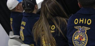 FFA members sit next to each other in chairs.