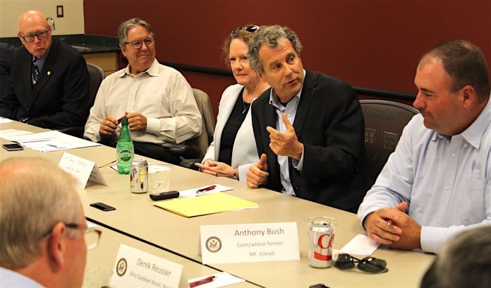 Brown closeup Senator Brown with farmers