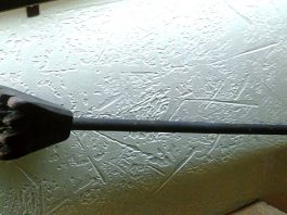 Item 1088 has a pyramid shaped head that is about 4 inches at its base with ridges and teeth on the bottom. The head tapers back into a long cylindrical pole.