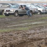 Pushing truck out of mud.