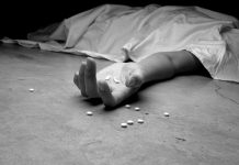 Farm groups launch campaign to address rural opioid epidemic A black and white image of an addict, dead beneath a sheet, arm outstretched, pills in the palm of their lifeless hand and littering the floor near their hand.