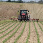 Tractor applying fertilizer