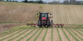 Some benefits of managing soil fertility in fall Tractor applying fertilizer