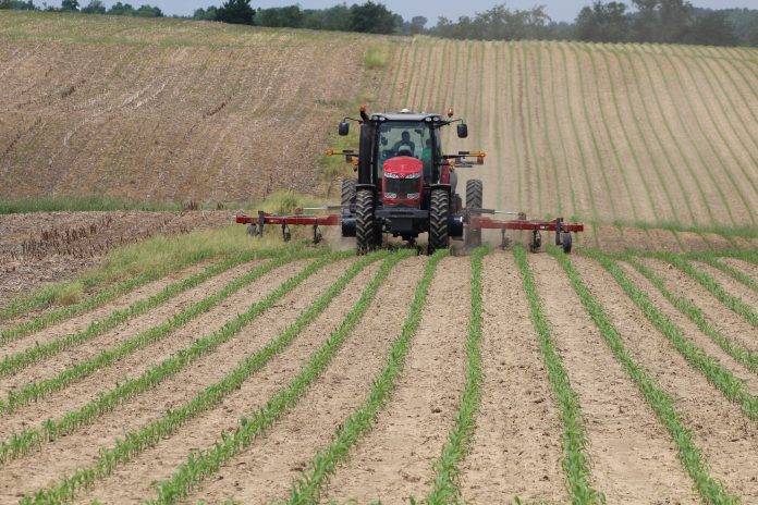 Tractor applying fertilizer