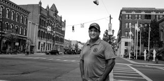 Brent Bennet stands on the corner of a Huron County street