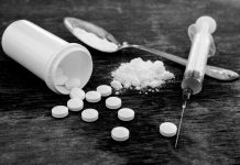 The opioid epidemic: Every life is worth saving Pills, Fentynal Powder, and Heroin syringe sit on a table