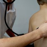Scoliosis screening is key for young children Child and doctor