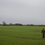 We’ve come a long way with soil technology man walking in a field