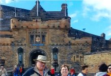 Visiting the Castle’s of Scotland with the Larricks The Larricks standing in front of Edinbugh Castle in Scotland with their Farm and Dairy