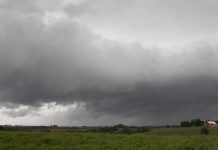 Climate change forces Midwest farmers to adapt storm clouds and farm