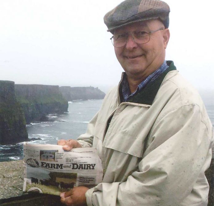 Mark Holian reads the Farm and Dairy at the Cliffs of Moher in Ireland