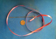 Can you identify this antique pin’s use or will you get stuck? Antique pin about 6 inches long with a large rounded opening at the one end.