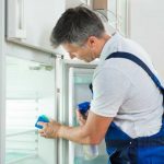 Spring Cleaning Checklist Should Include Your Fridge and Pantry, Too Man cleaning fridge