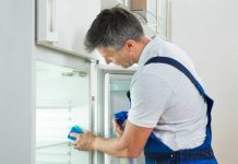 Spring Cleaning Checklist Should Include Your Fridge and Pantry, Too Man cleaning fridge