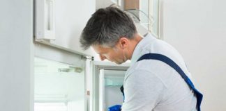 Toss it? Is food safe to eat after a flood? Man cleaning fridge