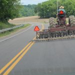 7 safety tips for driving farm equipment on the road tractor on the road